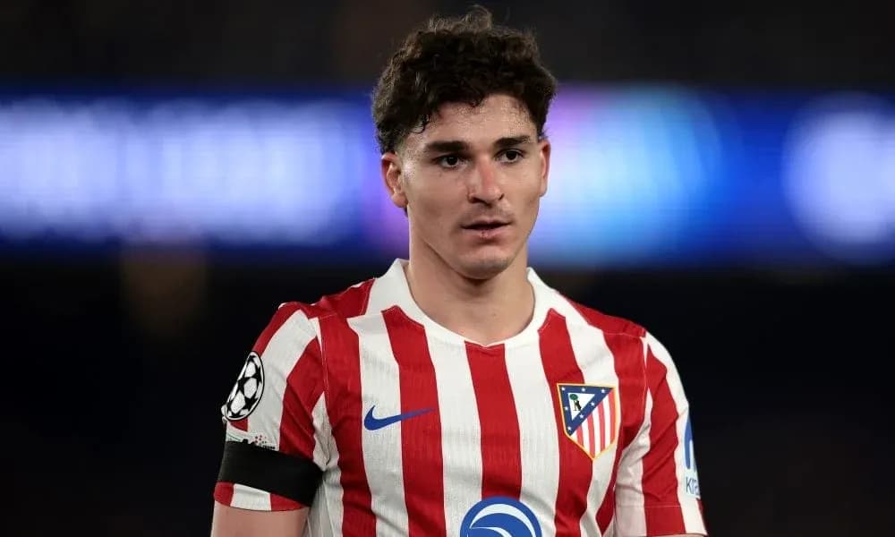 Atletico Madrid player in team jersey on pitch