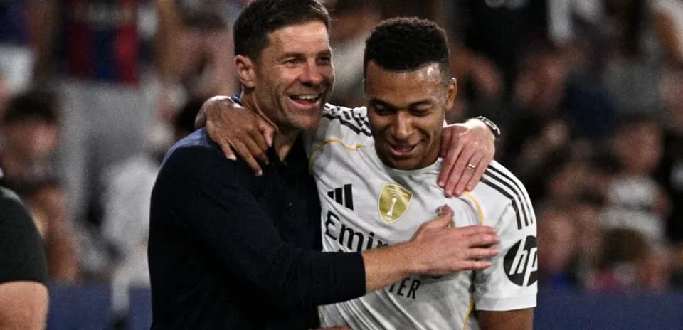 Coach and player celebrating after a match