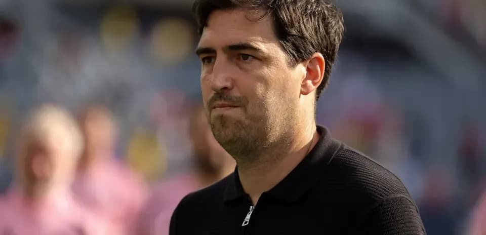 Coach observing the match from the sidelines