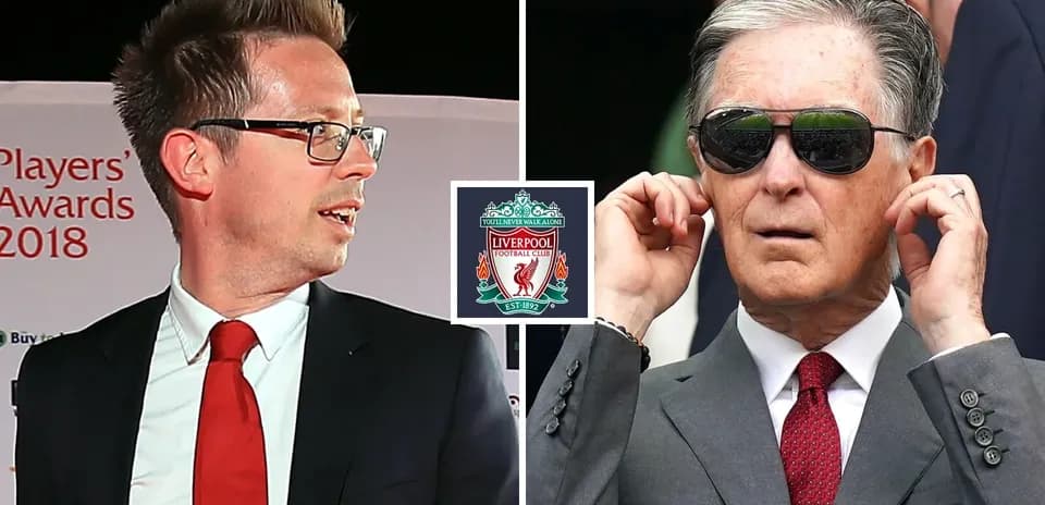 Two men at Liverpool event with club logo