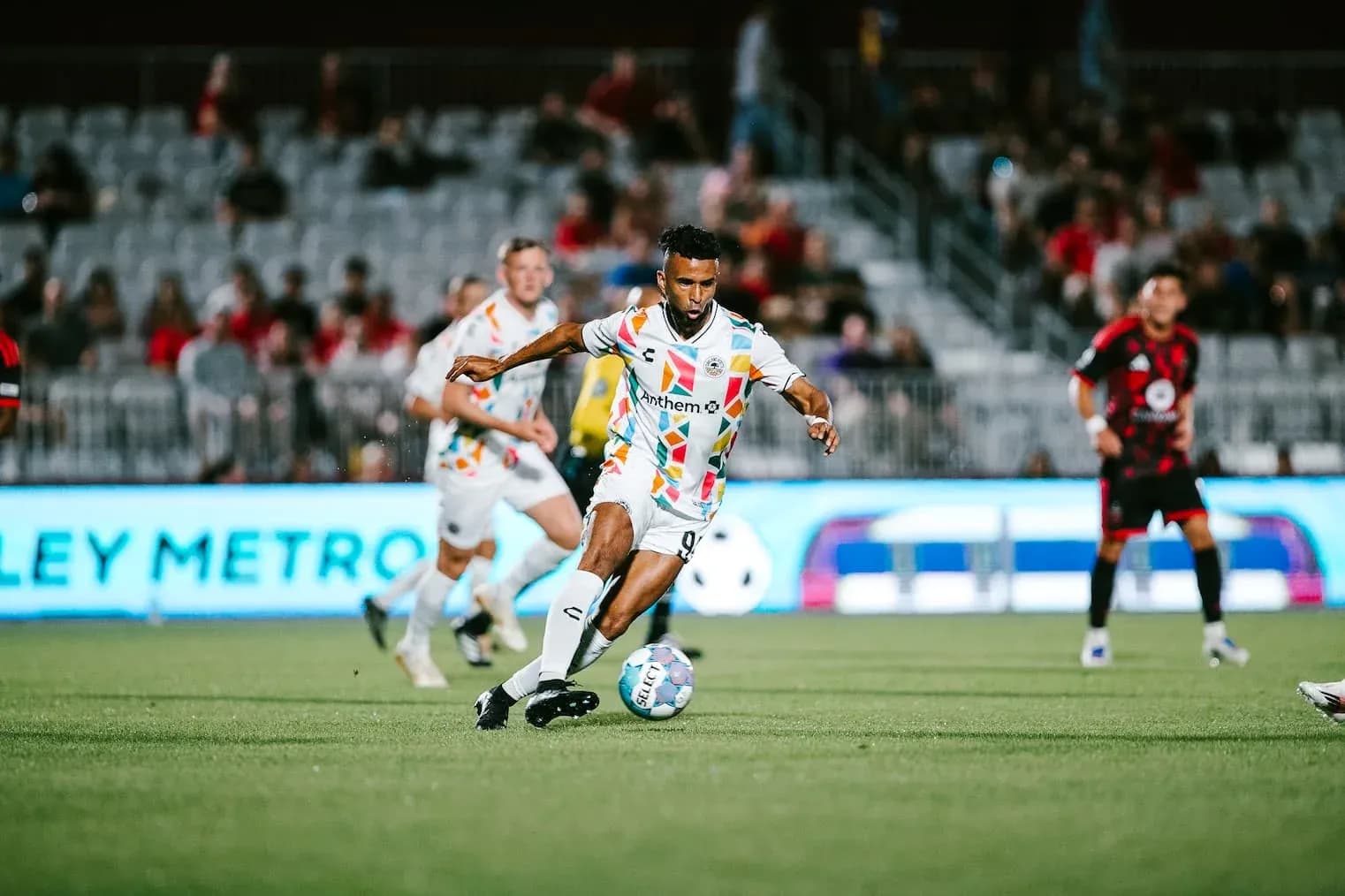 Player dribbling the ball during USL match