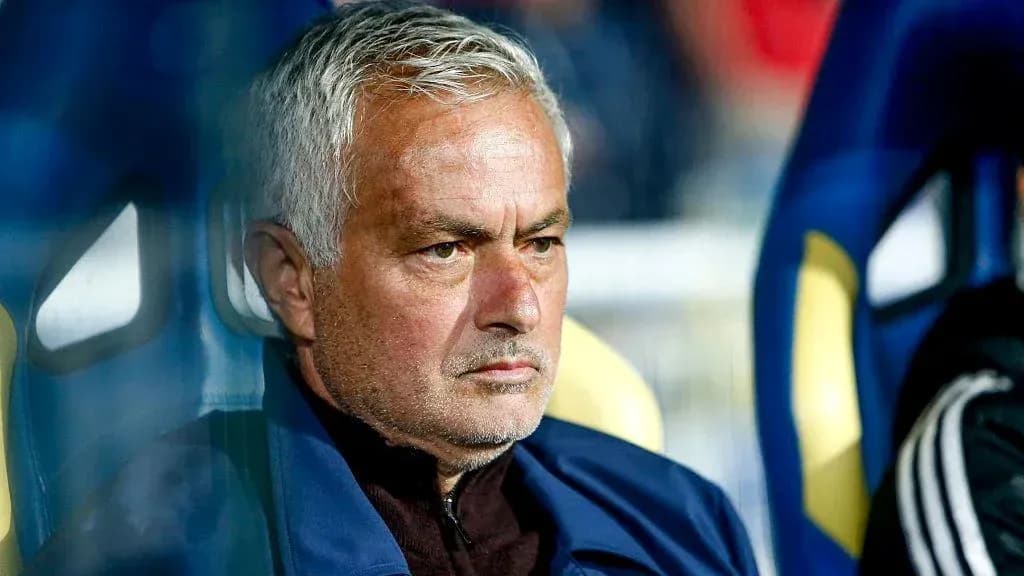 Coach sitting on the bench during a match