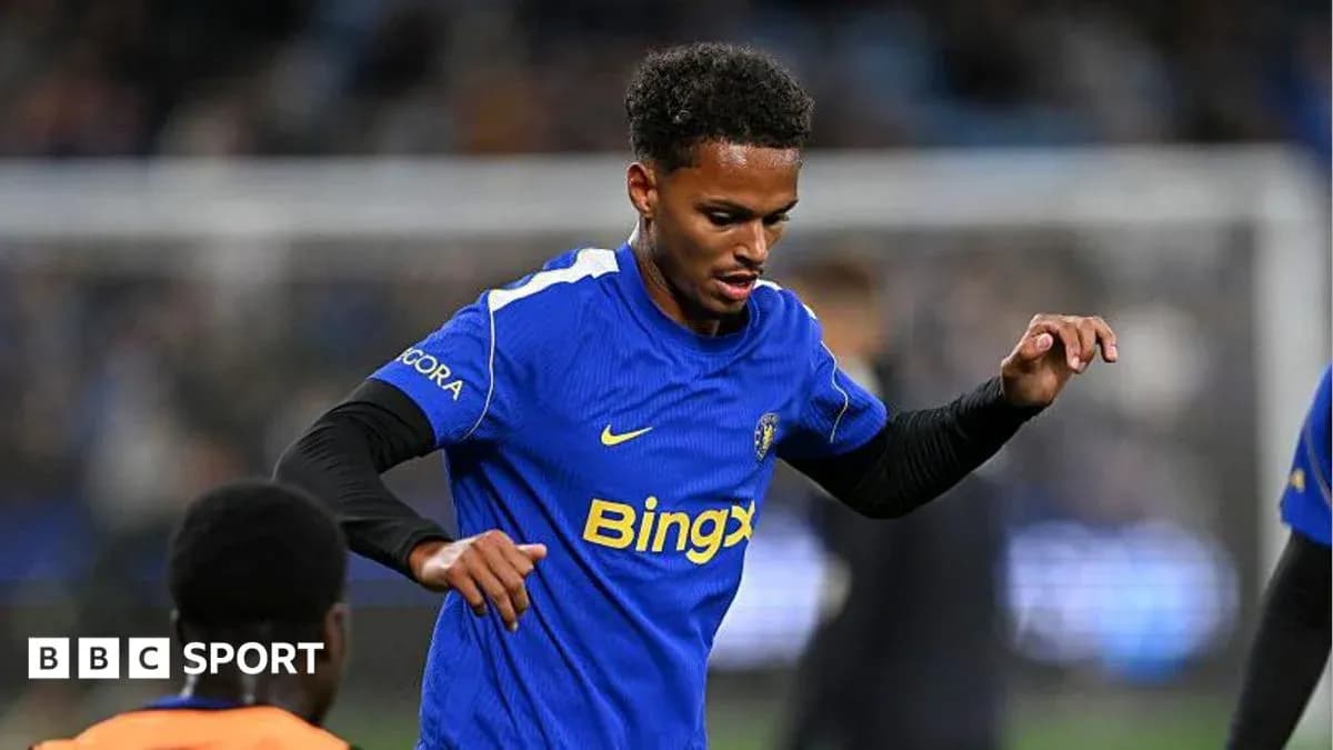 Player warming up in blue jersey before match