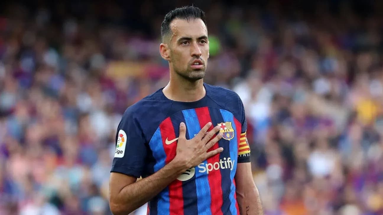 Sergio Busquets holding hand to chest during match