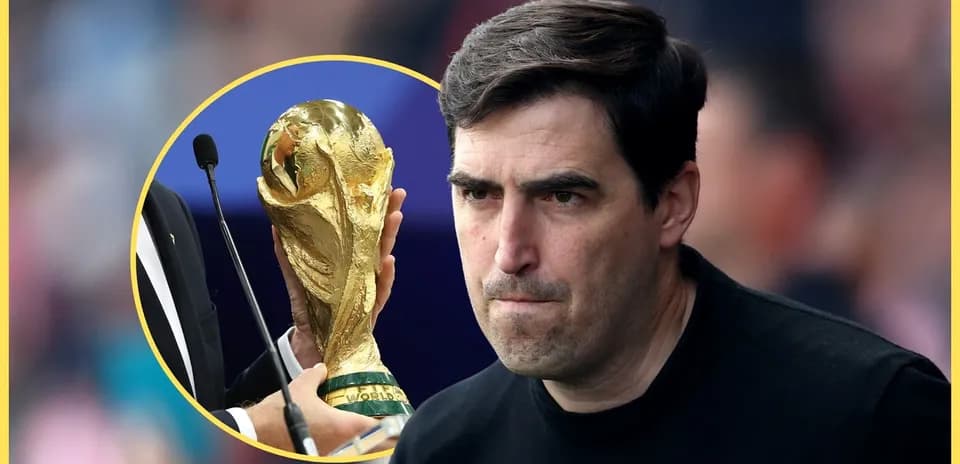 Coach looking serious with World Cup trophy background