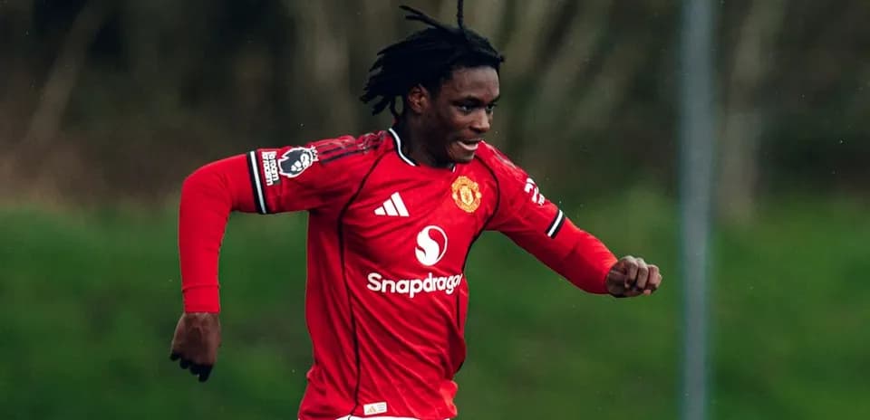 Player in red Manchester United kit running on field