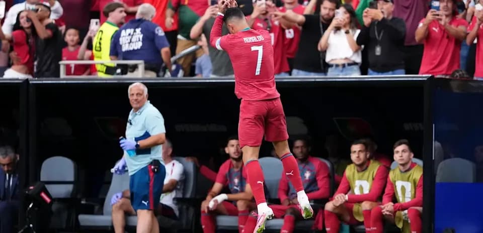 Player celebrating with fans during match