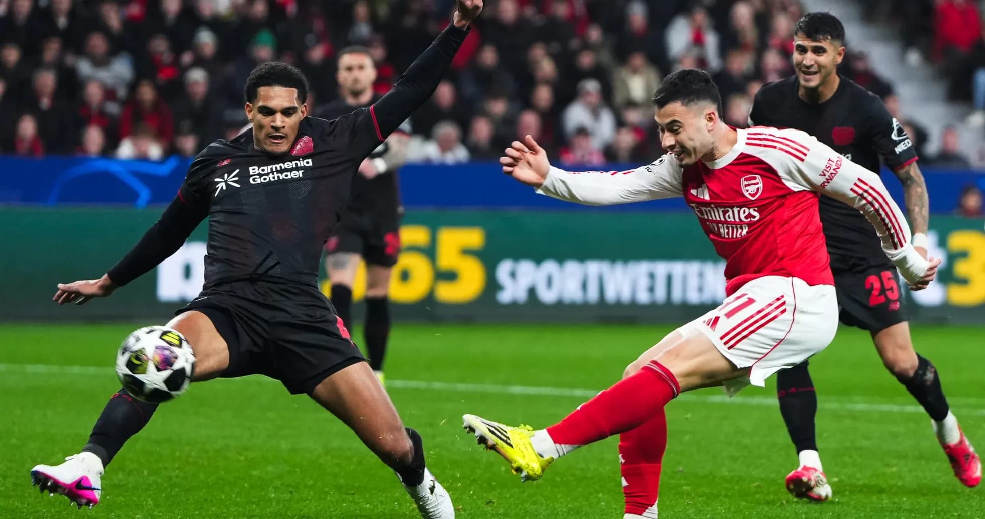 Arsenal player shooting during Champions League match