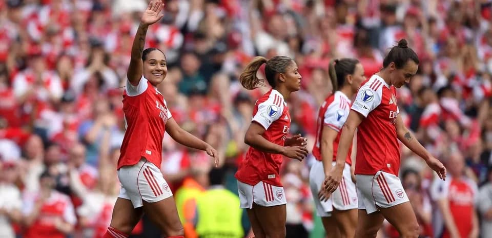 Arsenal women's players celebrating a goal during match