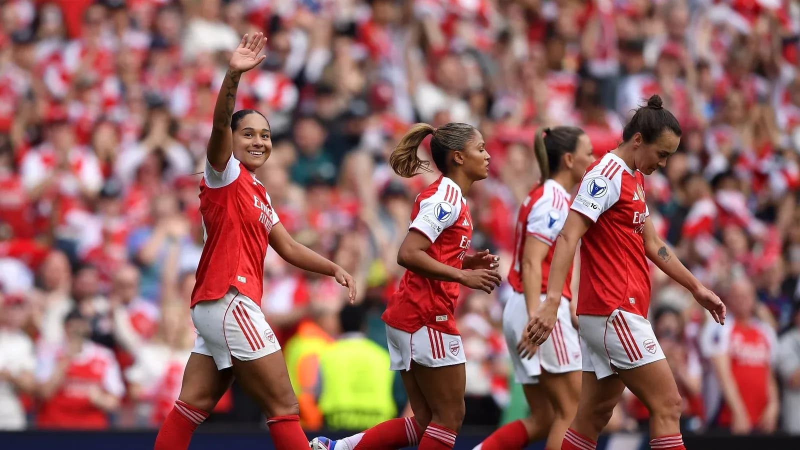 Arsenal women's players celebrating a goal during match