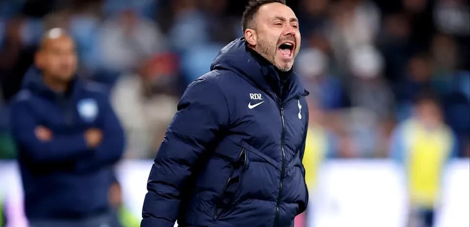 Coach shouting instructions during a football match