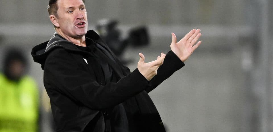 Coach giving instructions from the sidelines