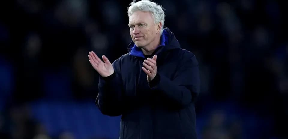 Manager applauding fans after match conclusion