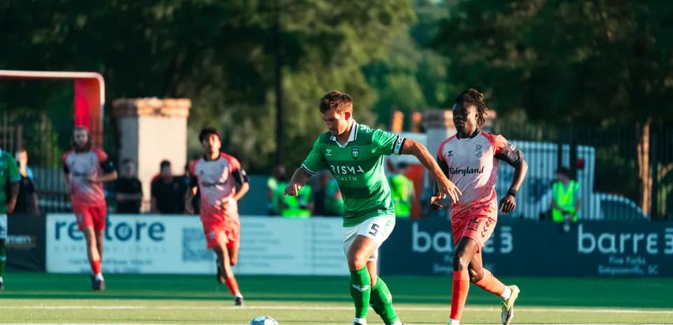 Player dribbling the ball during USL League One match