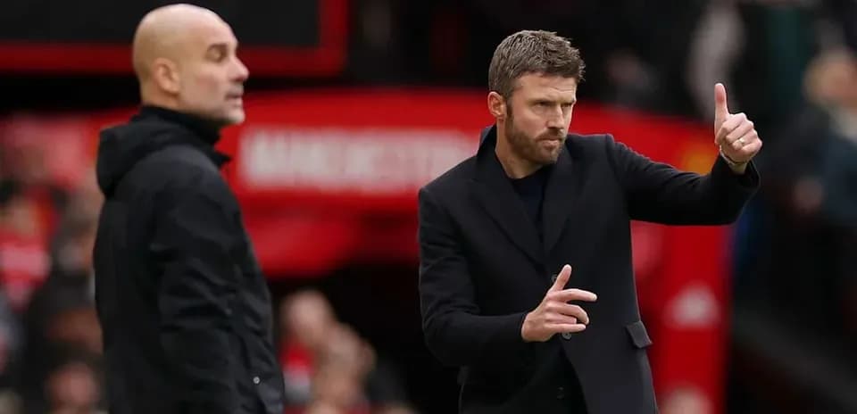 Two football managers on the sideline during match
