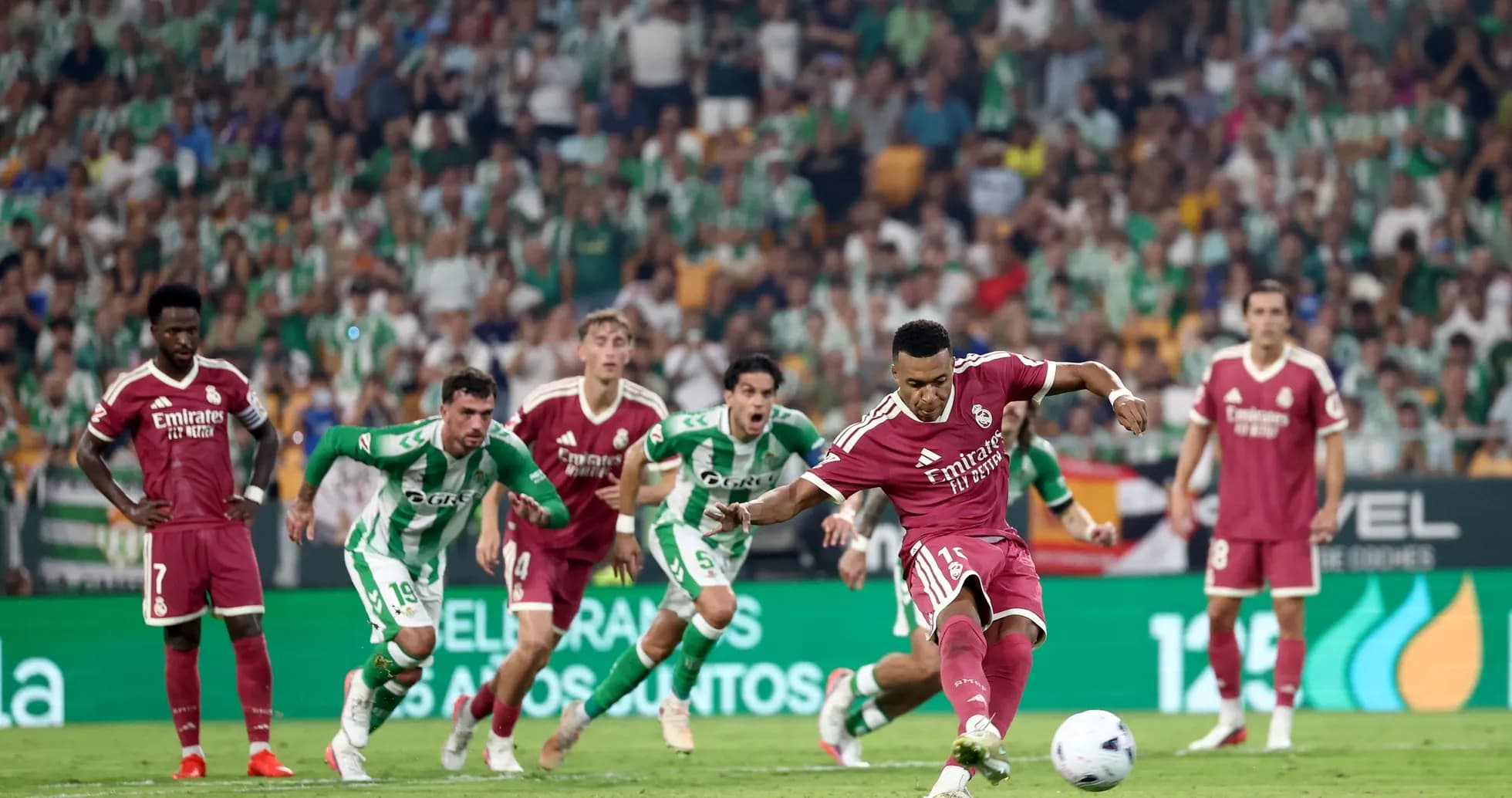 Player taking a penalty kick during the match