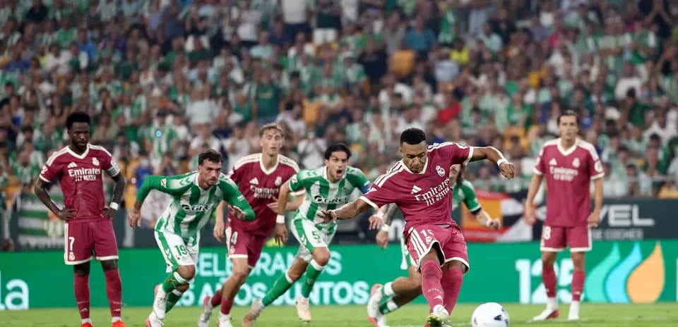 Player taking a penalty kick during the match