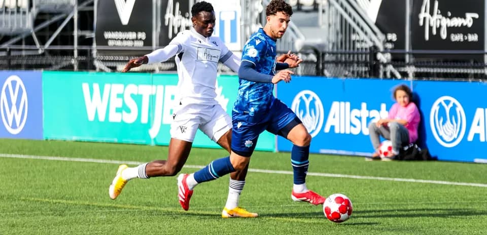 Vancouver FC player competing for the ball