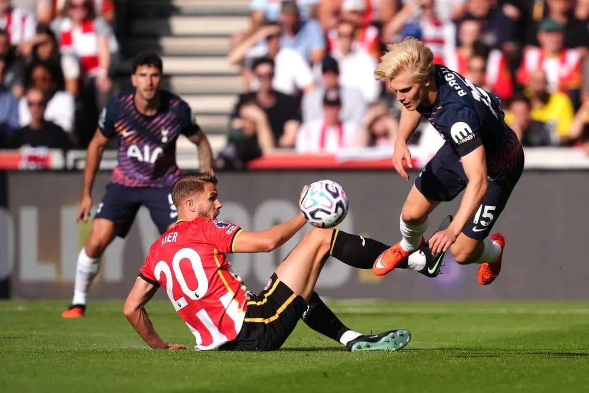 Player tackling another player during football match