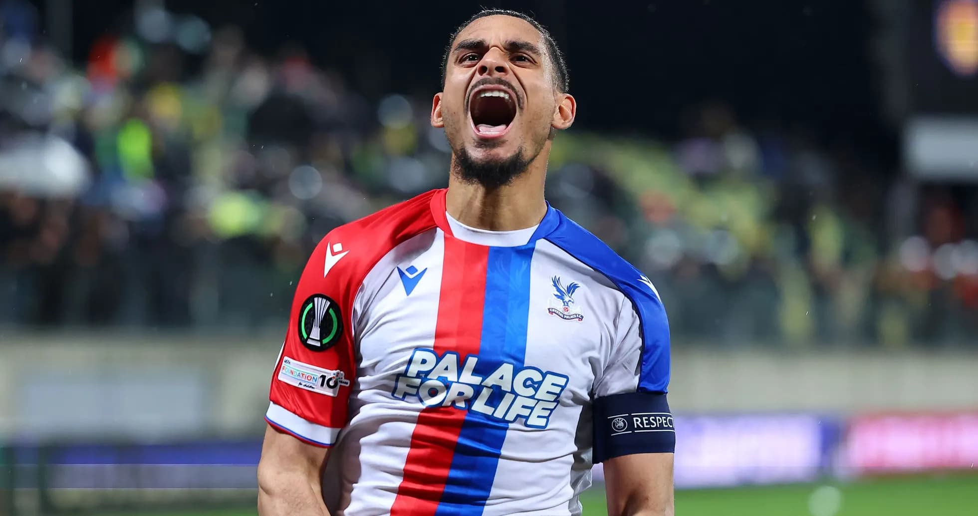 Player celebrating passionately in Crystal Palace jersey