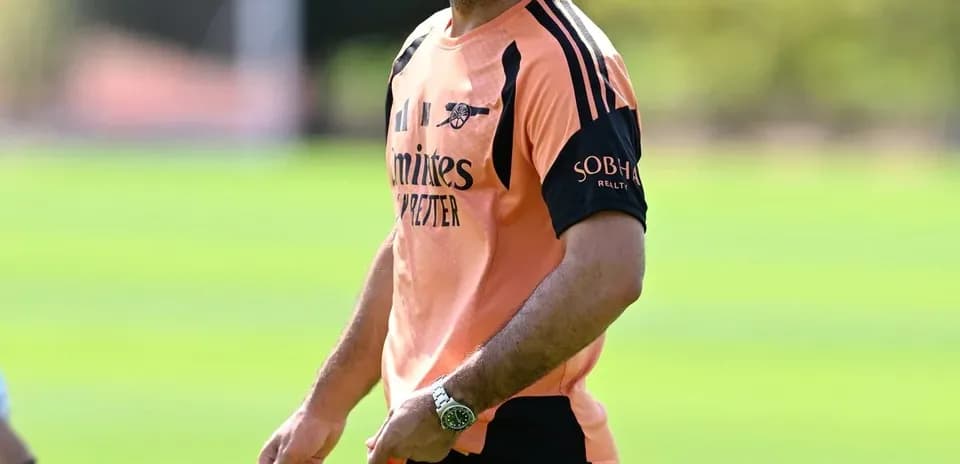 Coach smiling while holding a training device