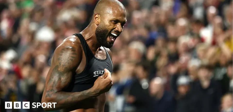 Athlete celebrating passionately in front of crowd