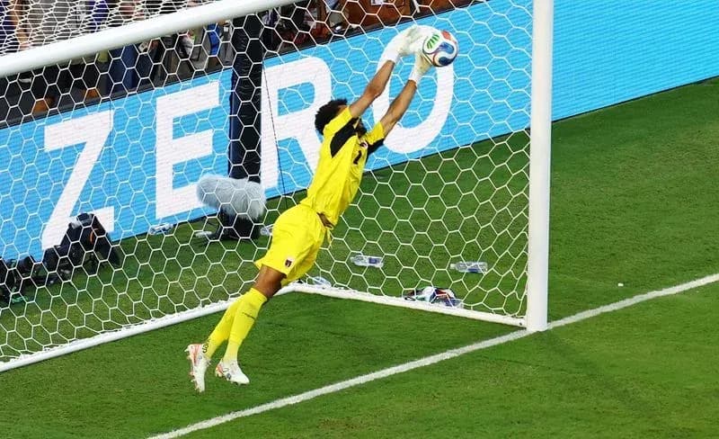 Goalkeeper diving to save a penalty kick