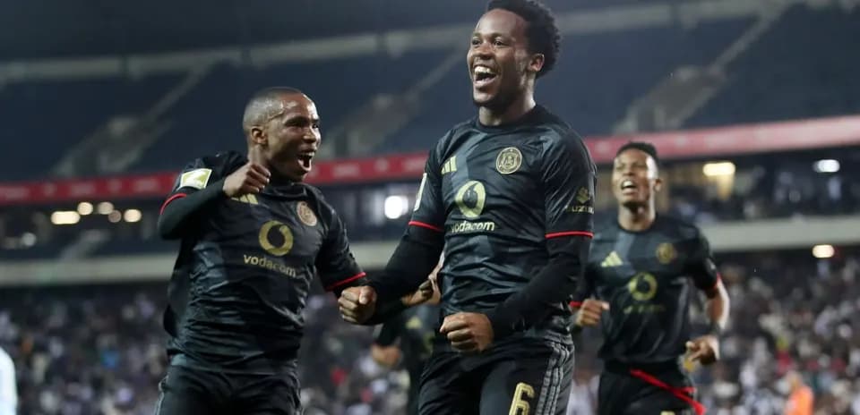 Players celebrating a goal during a football match