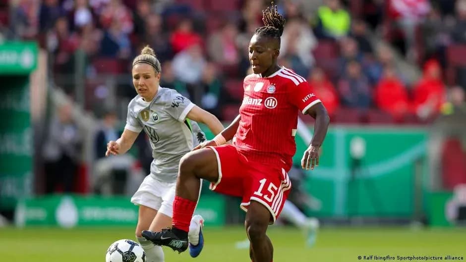 Two players competing for the ball during match