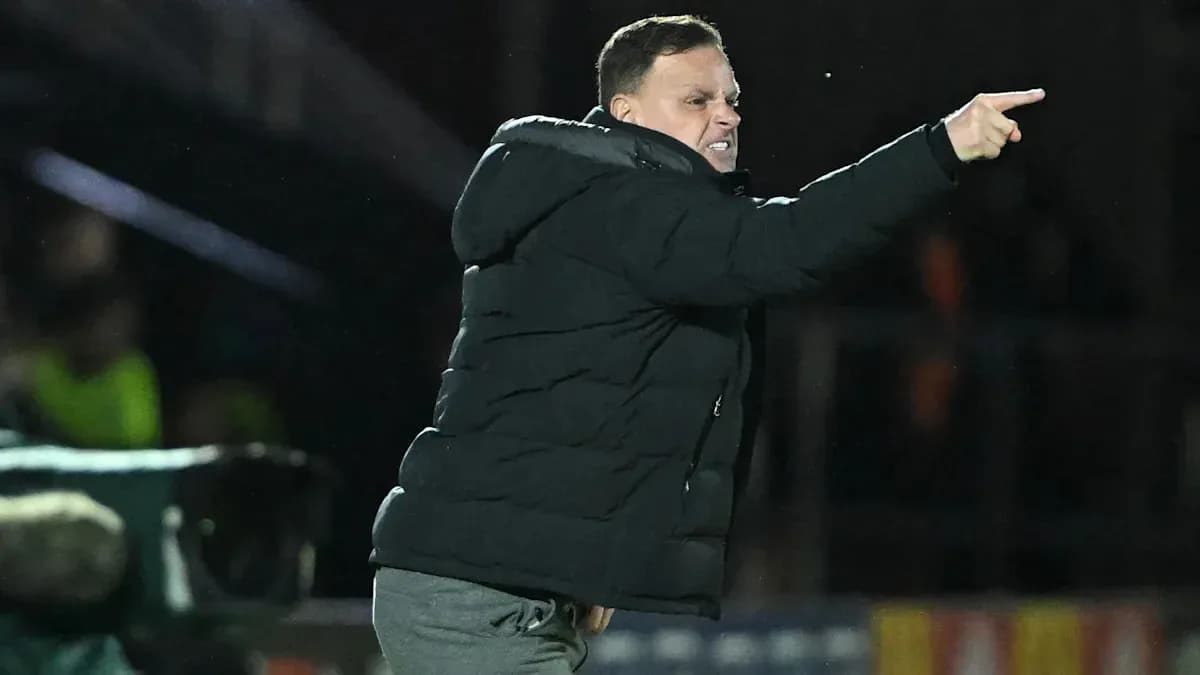 Coach directing players from the sidelines during match