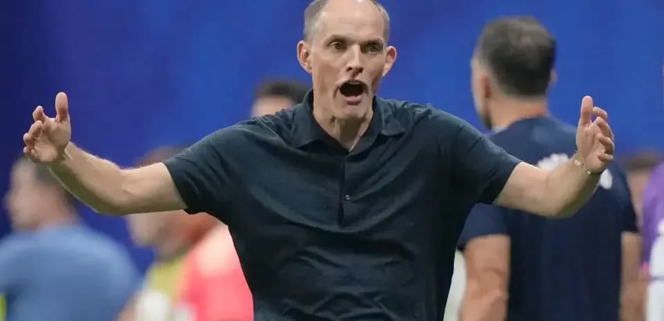 Coach gesturing during a match on the sideline
