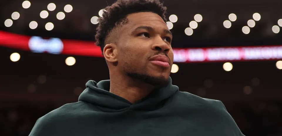 Player wearing hoodie during basketball game warm-up