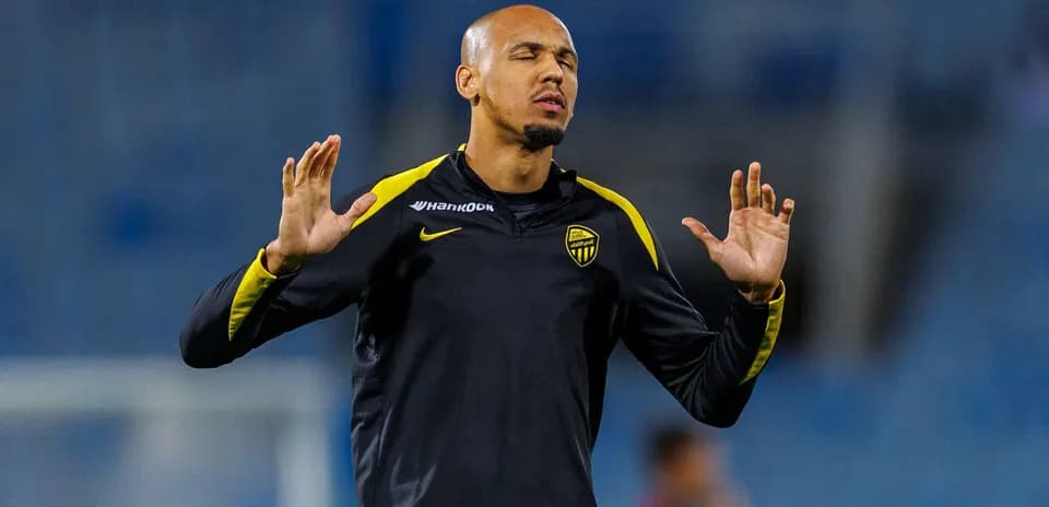 Player warming up with hands raised during training