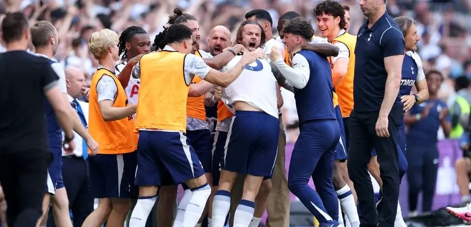 Tottenham players celebrating a goal on the pitch