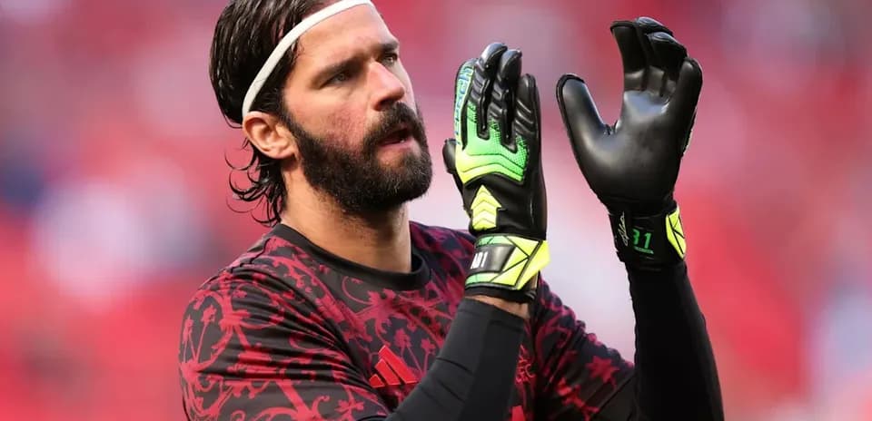 Goalkeeper preparing with gloves before the match