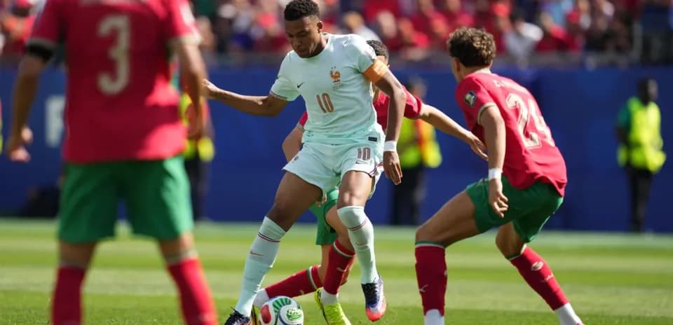 Player dribbling the ball during match between teams