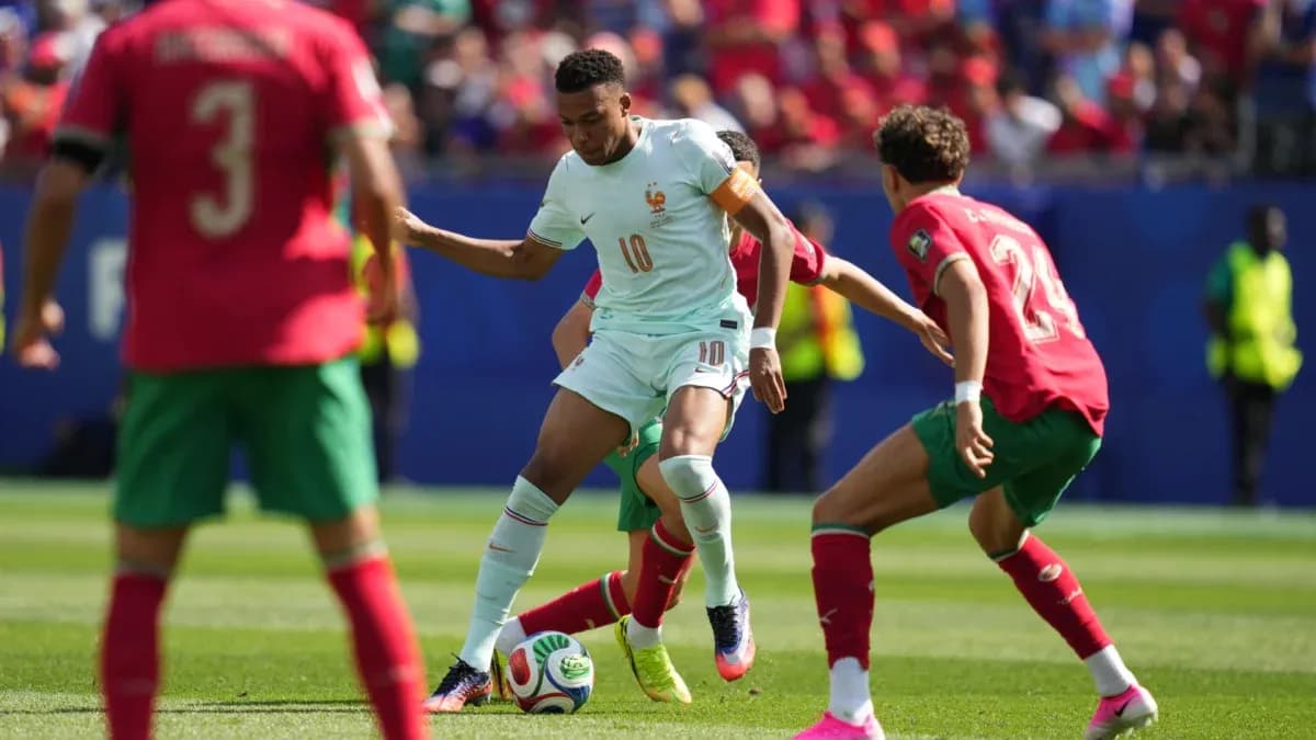 Player dribbling the ball during match between teams