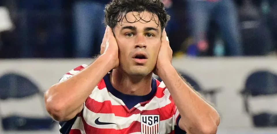 Player covering ears during intense moment on field