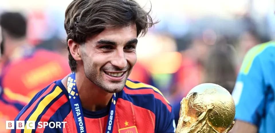 Player celebrating with FIFA World Cup trophy