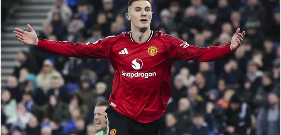 Player celebrating a goal in Manchester United jersey