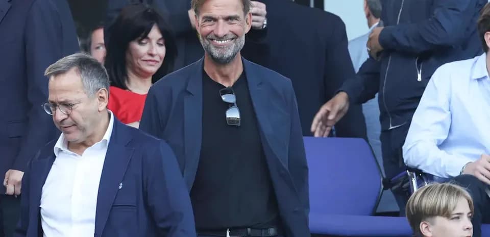 Man smiling in a suit at an event