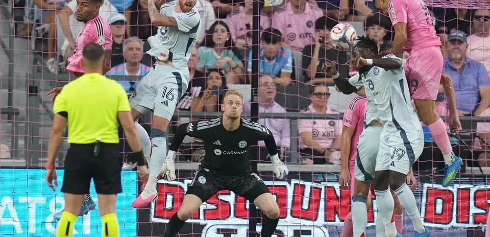 Players contesting for the ball during match