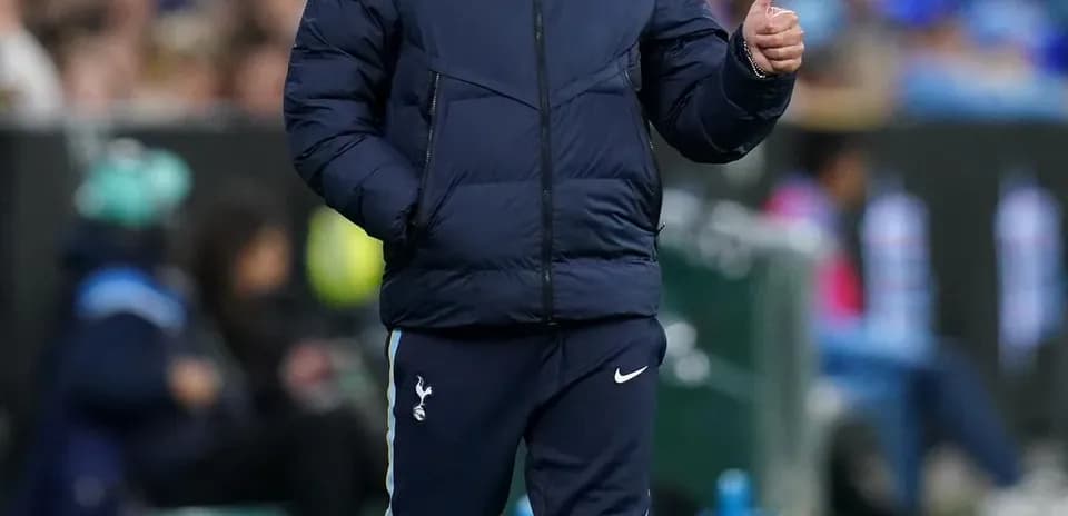 Coach gesturing during a match on the sideline