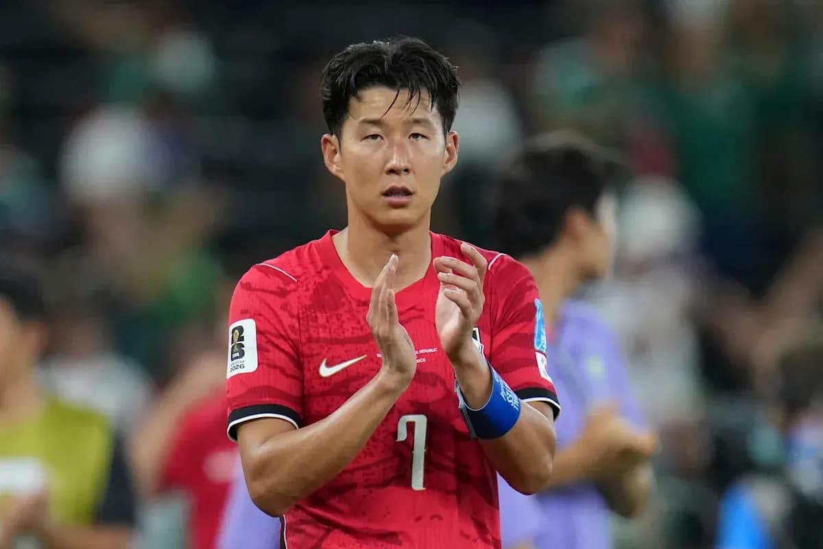Player applauding after the match in red jersey