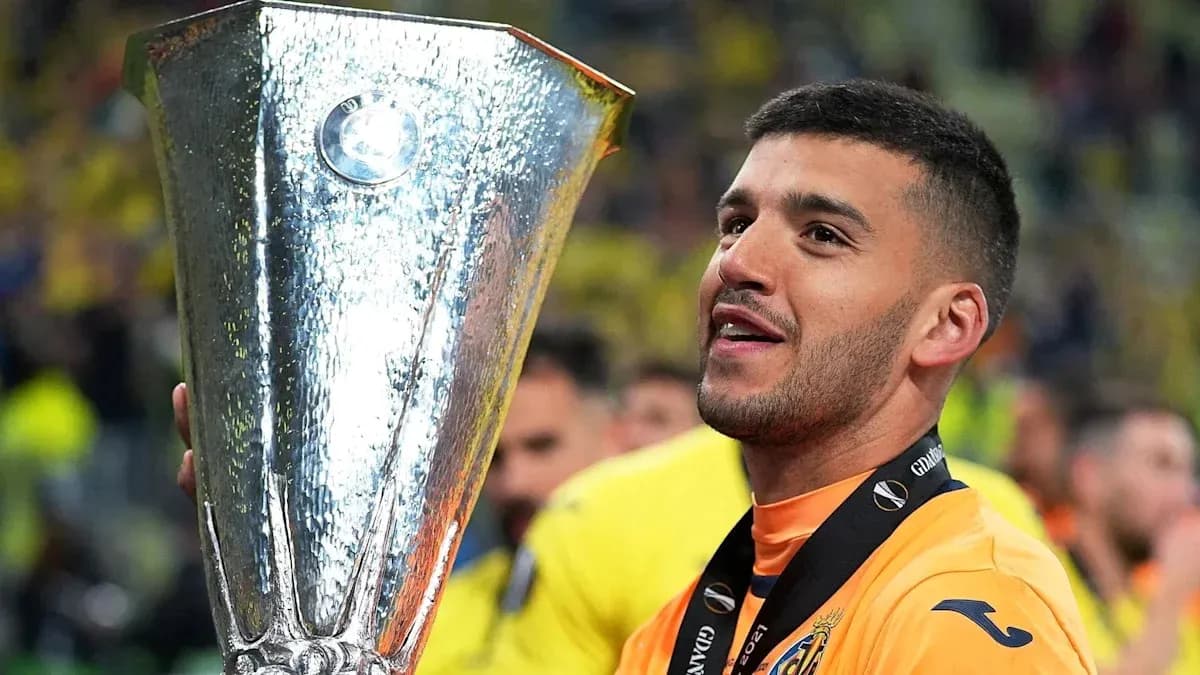 Player celebrating with UEFA Europa League trophy