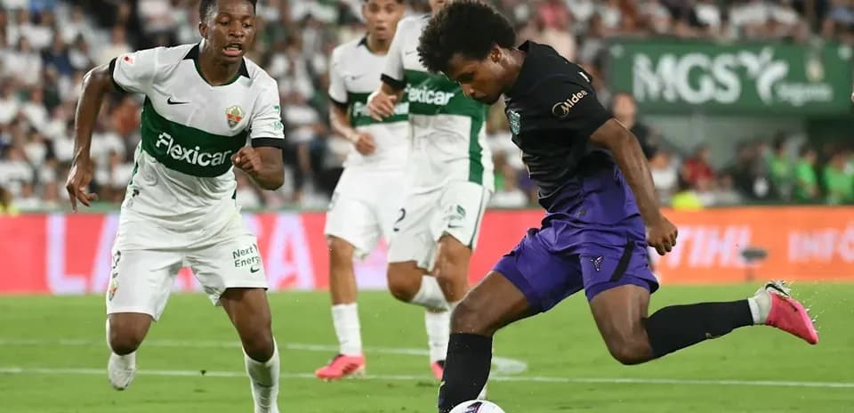 Player dribbling past opponent during soccer match