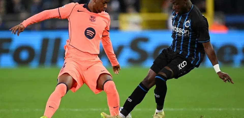 Two players competing for the ball during match