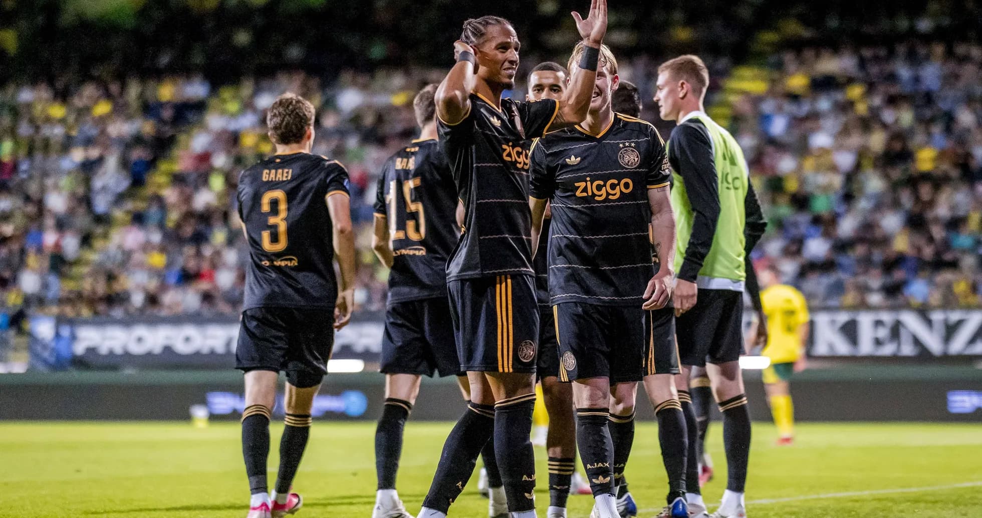 Ajax players celebrating a goal on the field