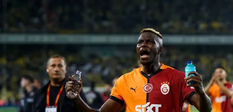 Player celebrating with water bottles after match