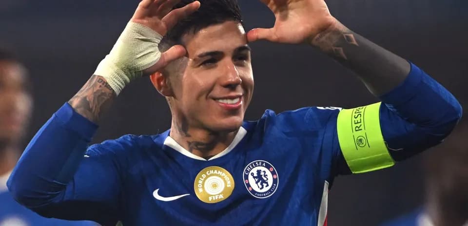 Player celebrating in Chelsea kit with captain's armband